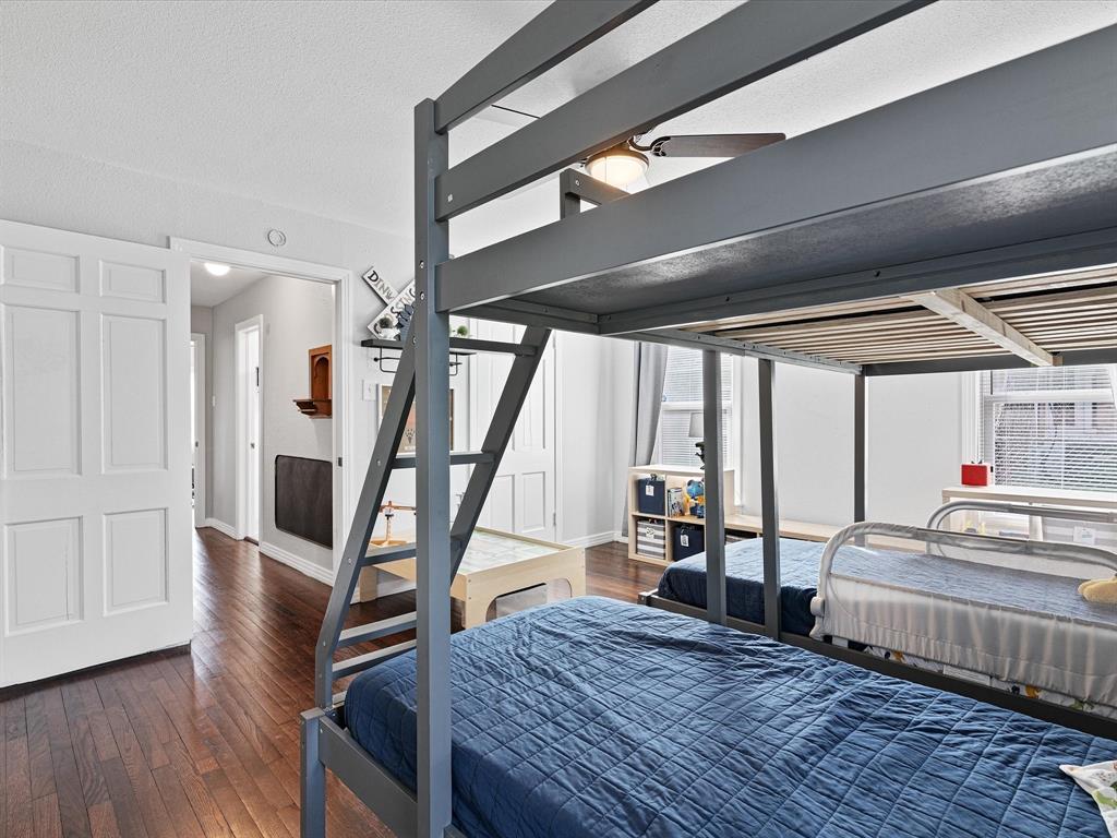 1308 Myrtle Street Denton, TX 76201 - Photo 29 of 35 a living room with furniture and a wooden floor