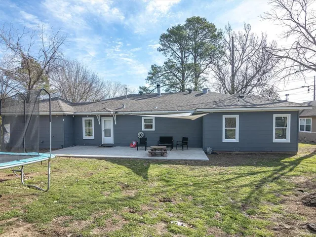 a house view with swimming pool and porch