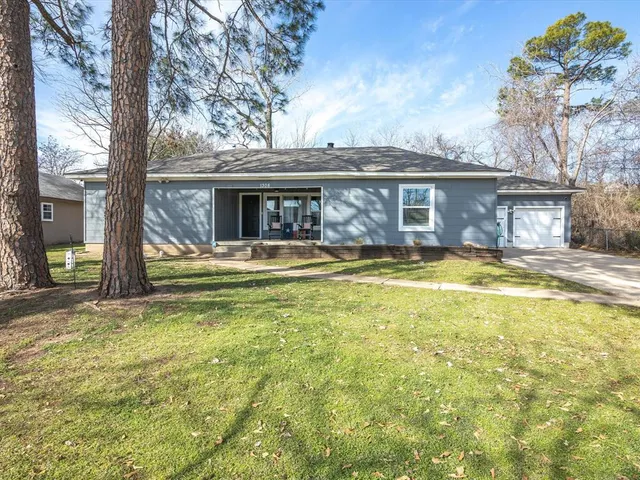 a view of a house with swimming pool and sitting area