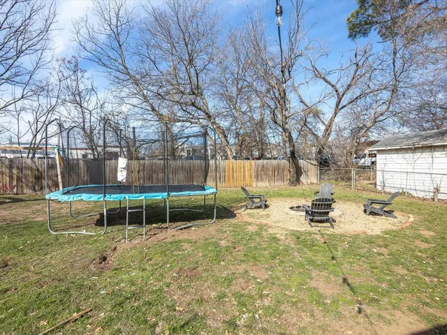 a view of a backyard with a sitting area and slide