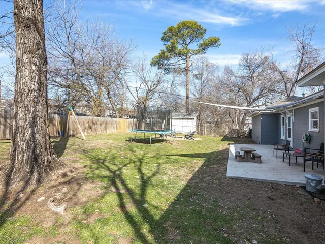 a view of yard with swimming pool and sitting area
