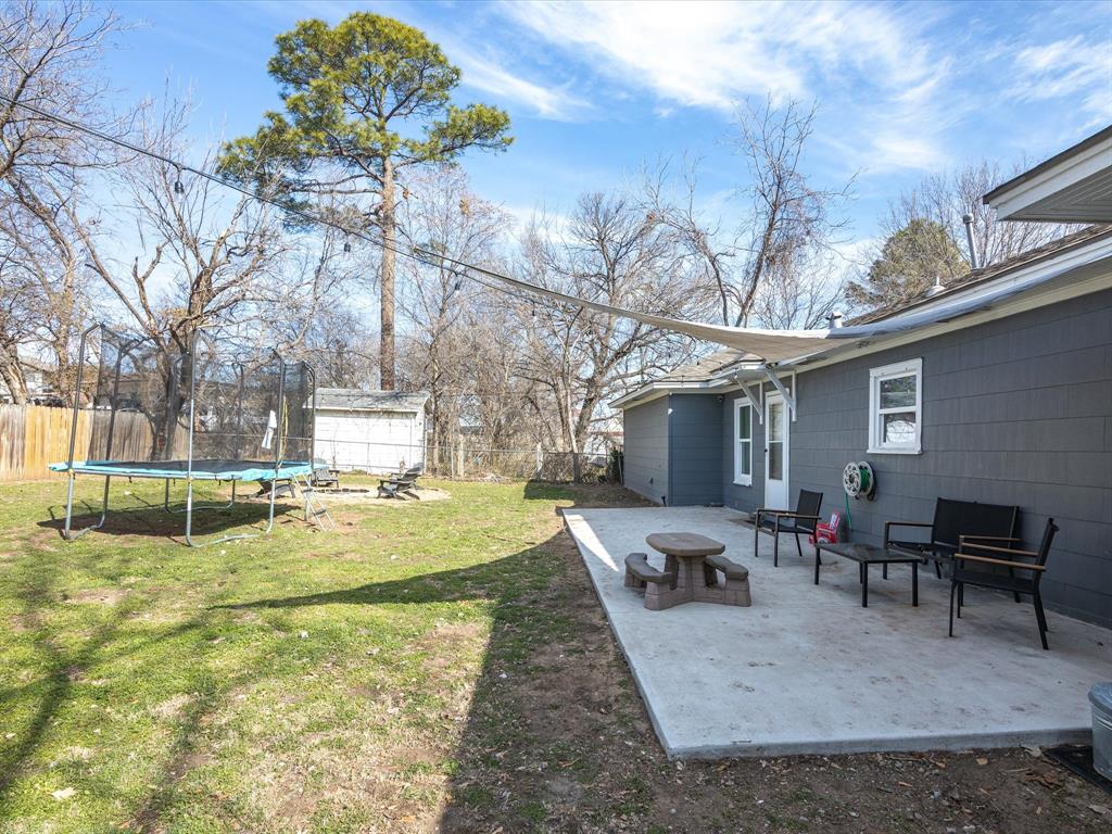1308 Myrtle Street Denton, TX 76201 - Photo 35 of 35 a view of a backyard with table and chairs