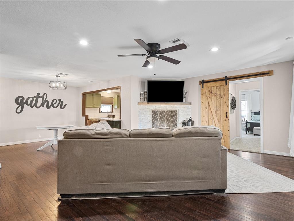 1308 Myrtle Street Denton, TX 76201 - Photo 9 of 35 a living room with furniture and a flat screen tv