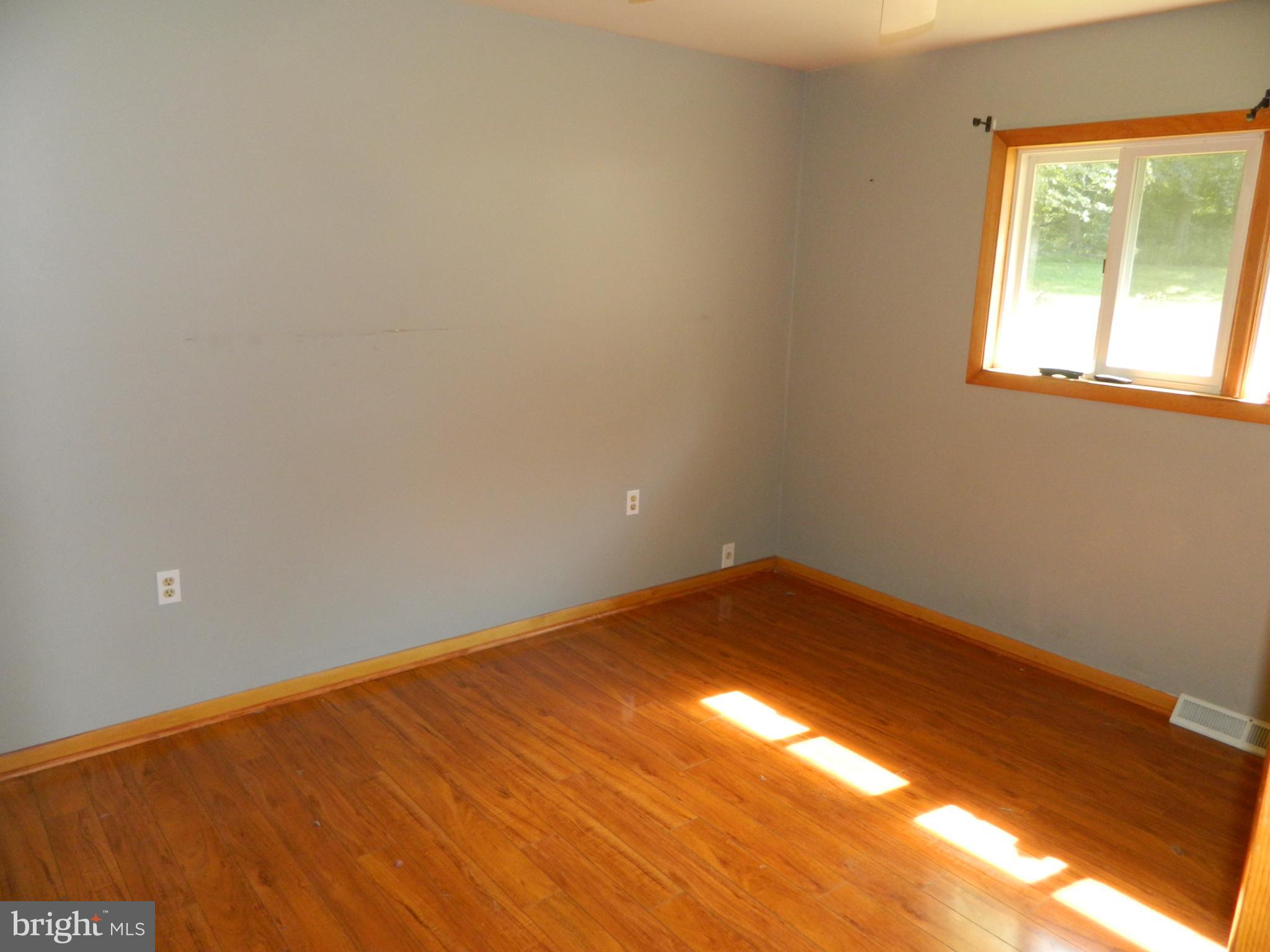 3910 Ady Road Pylesville, MD 21132 - Photo 14 of 24 Bright and airy room with warm wood floors.