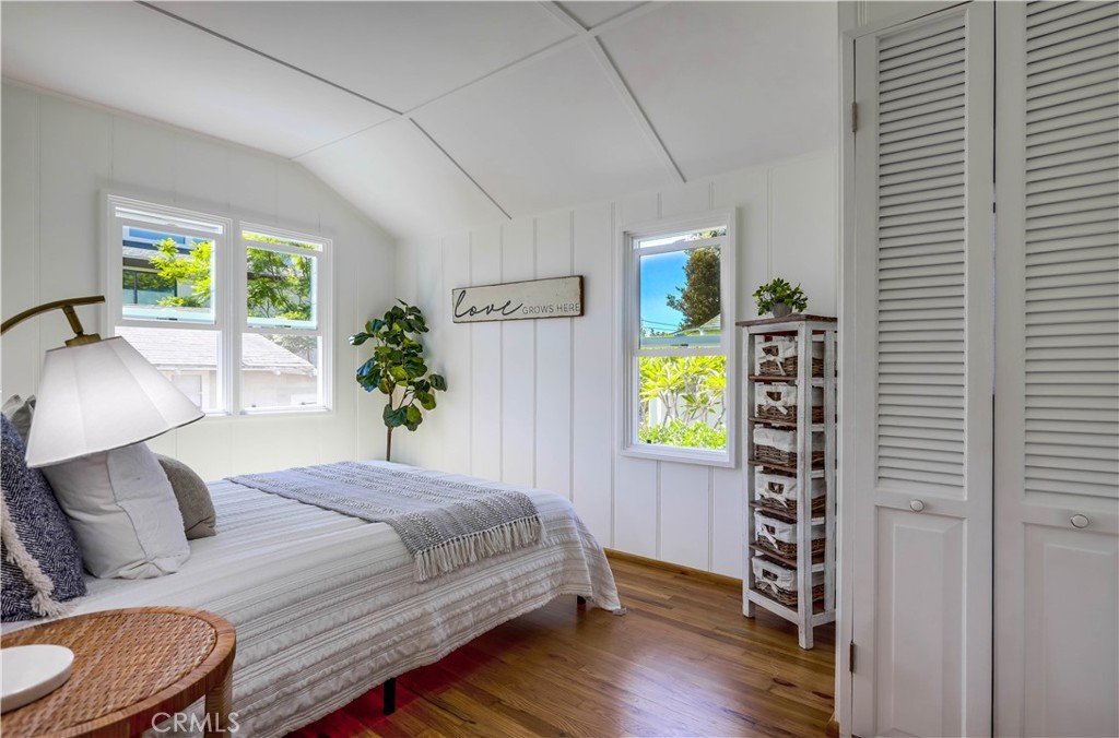 464 Agate Street, Unit A/B Laguna Beach, CA 92651 - Photo 24 of 75 a bedroom with a bed and a window