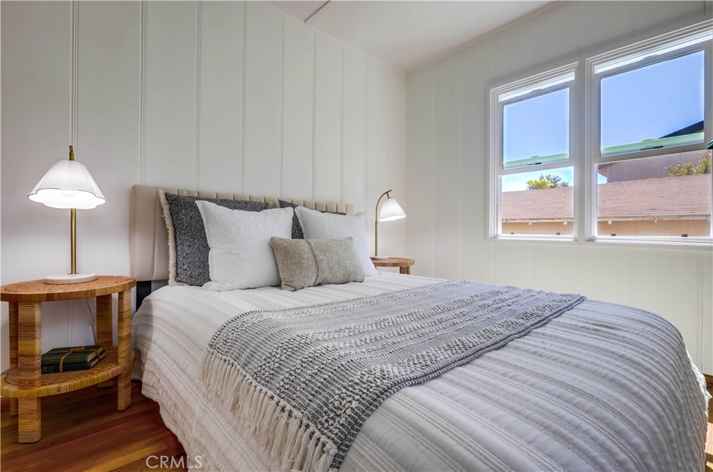 464 Agate Street, Unit A/B Laguna Beach, CA 92651 - Photo 25 of 75 a bedroom with a bed and a lamp