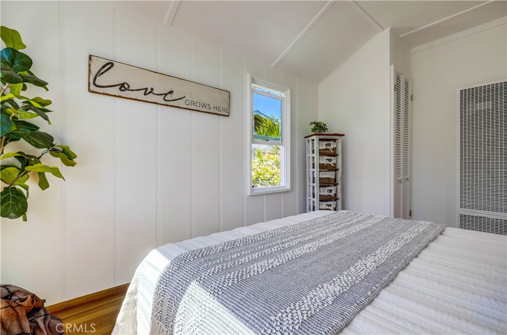 464 Agate Street, Unit A/B Laguna Beach, CA 92651 - Photo 26 of 75 a bedroom with a bed and a window in it