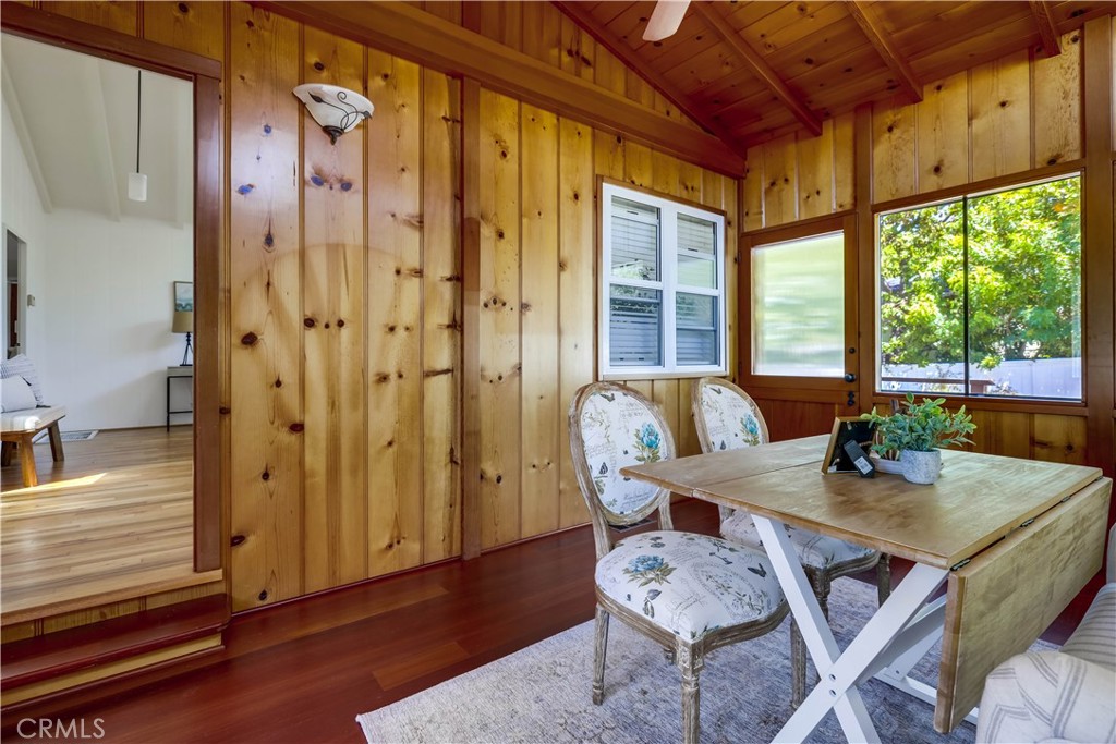 464 Agate Street, Unit A/B Laguna Beach, CA 92651 - Photo 37 of 75 a view of a dining room with furniture wooden floor and a chandelier