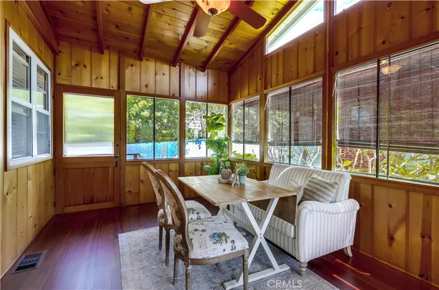 a spacious bedroom with a bed and a chandelier