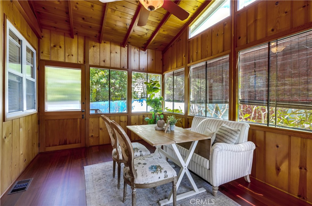 464 Agate Street, Unit A/B Laguna Beach, CA 92651 - Photo 38 of 75 a view of a dining room with furniture large windows and wooden floor
