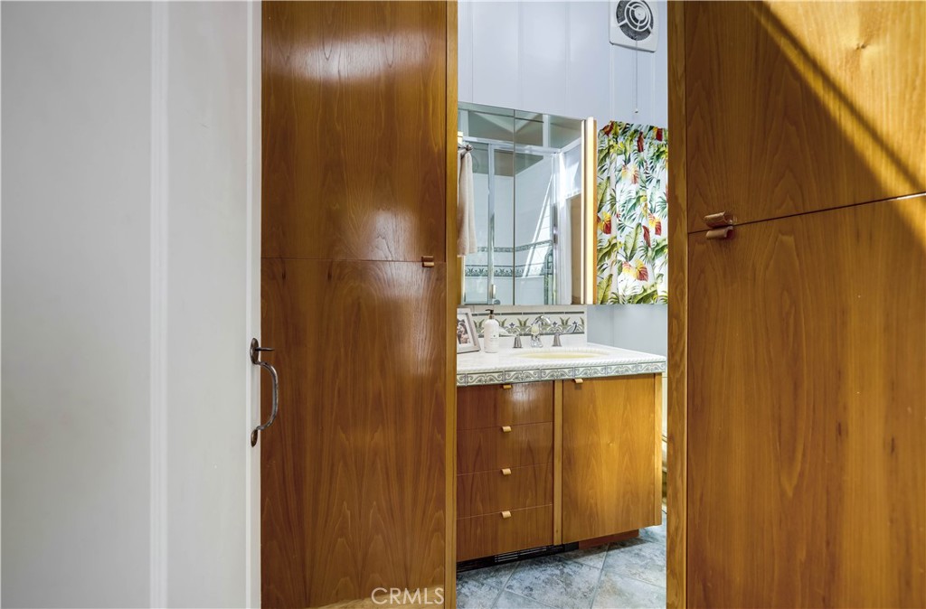 464 Agate Street, Unit A/B Laguna Beach, CA 92651 - Photo 64 of 75 a bathroom with a sink and a mirror
