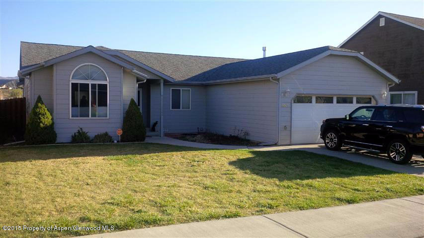 1067 East 18th Street Rifle, CO 81650 - Photo 1 of 14 a house view with a garden space