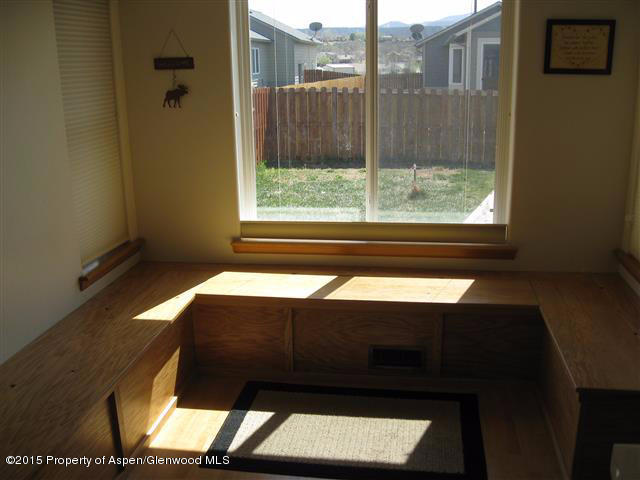 1067 East 18th Street Rifle, CO 81650 - Photo 6 of 14 a room with a bed and a window