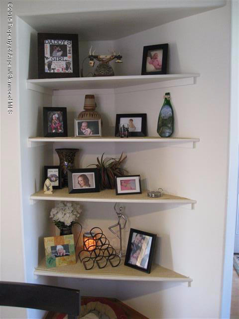 1067 East 18th Street Rifle, CO 81650 - Photo 8 of 14 a shelf with books and knick knacks on it