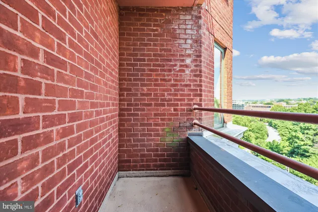 a kitchen with stainless steel appliances granite countertop a refrigerator a sink and wooden cabinets