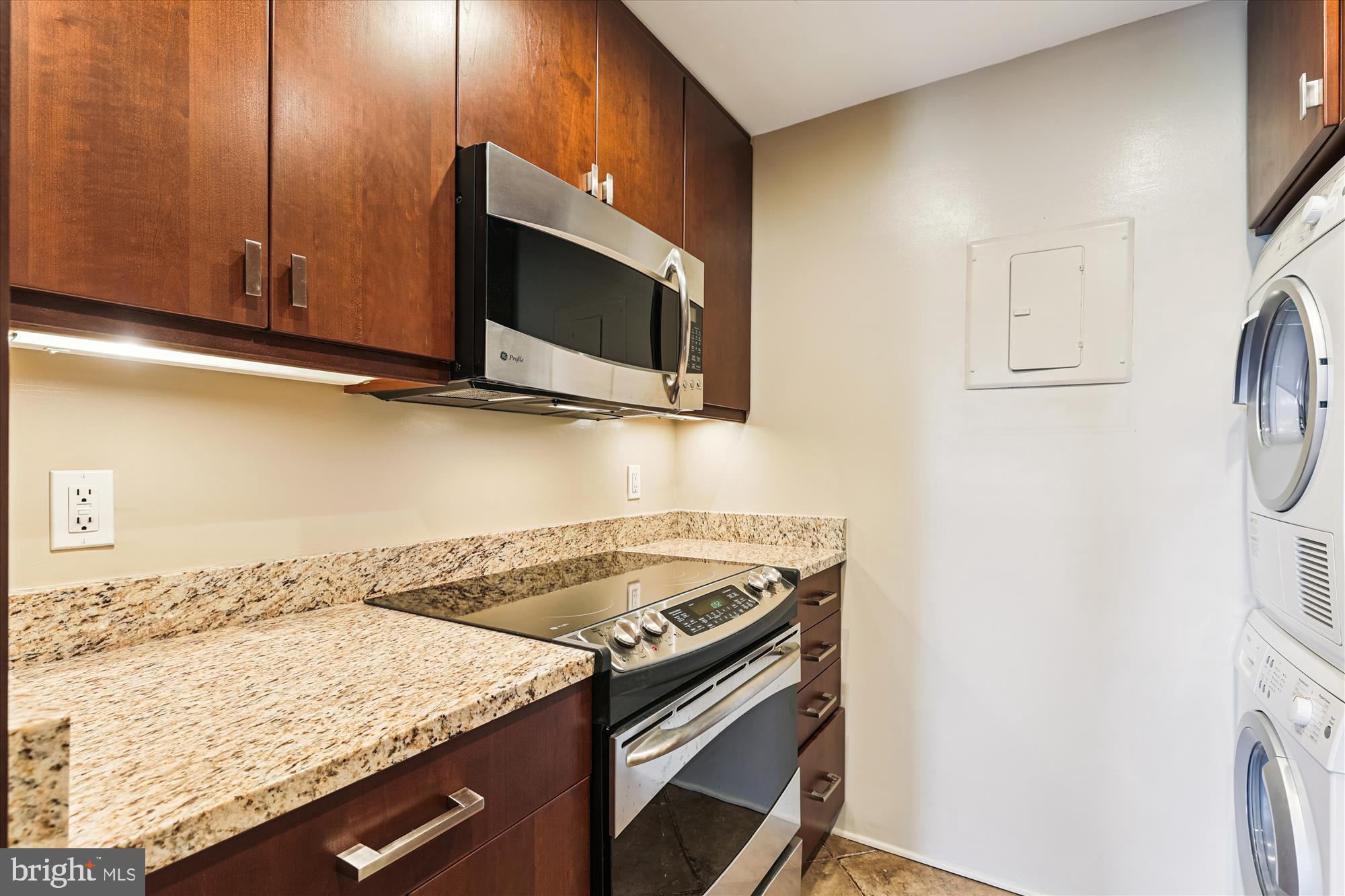 955 26th Street Northwest, Unit 803 Washington, DC 20037 - Photo 16 of 54 a kitchen with a stove and a microwave