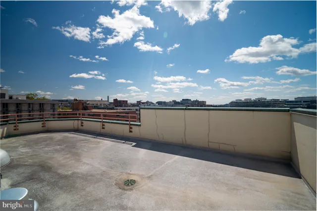 a view of a patio with furniture and garden
