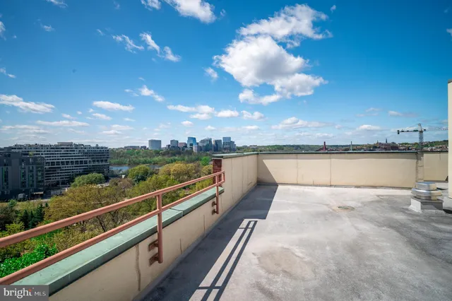 a view of a street with cars parked
