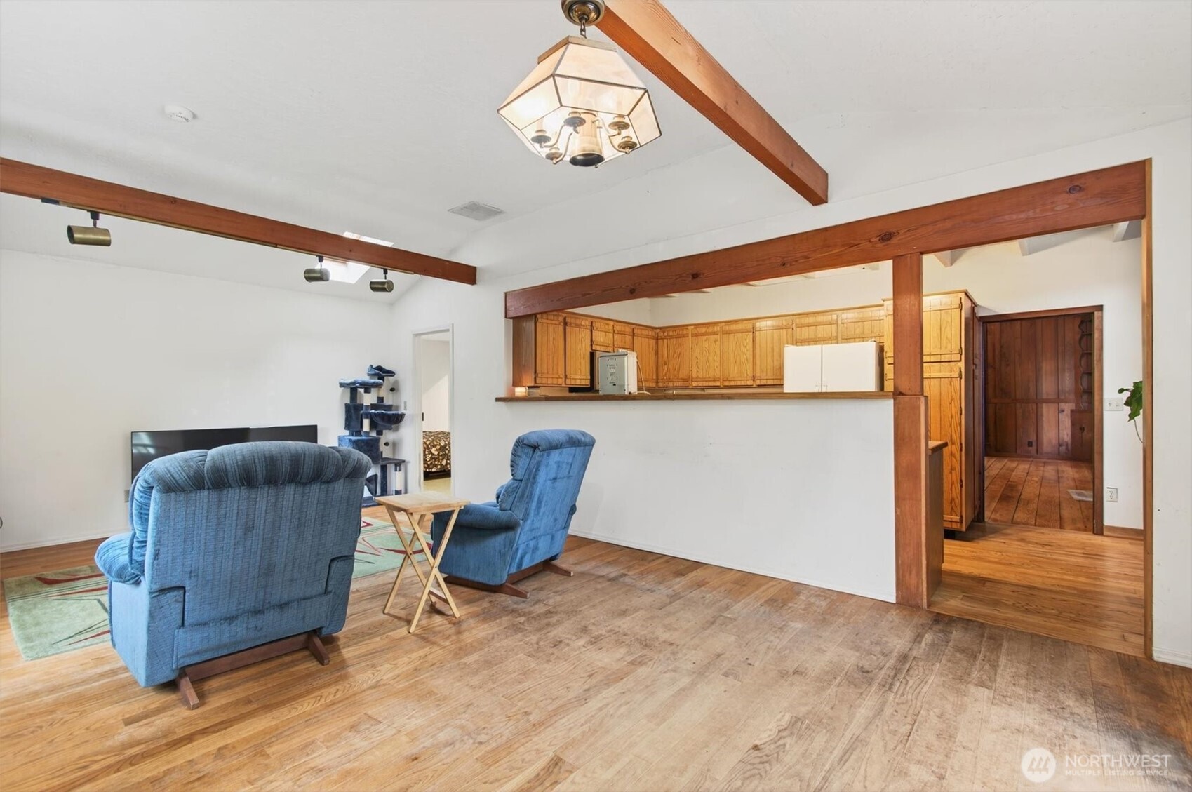 1015 Hazel Dell Road Castle Rock, WA 98611 - Photo 22 of 35 a living room with furniture and a chandelier