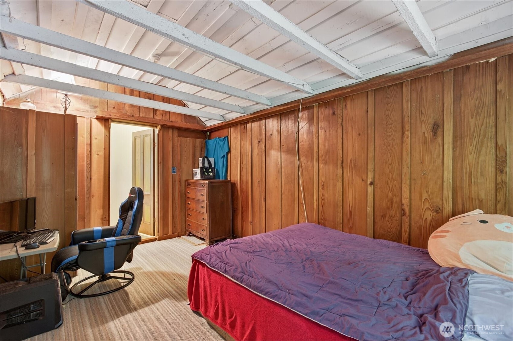 1015 Hazel Dell Road Castle Rock, WA 98611 - Photo 28 of 35 a bedroom with a bed and a chandelier