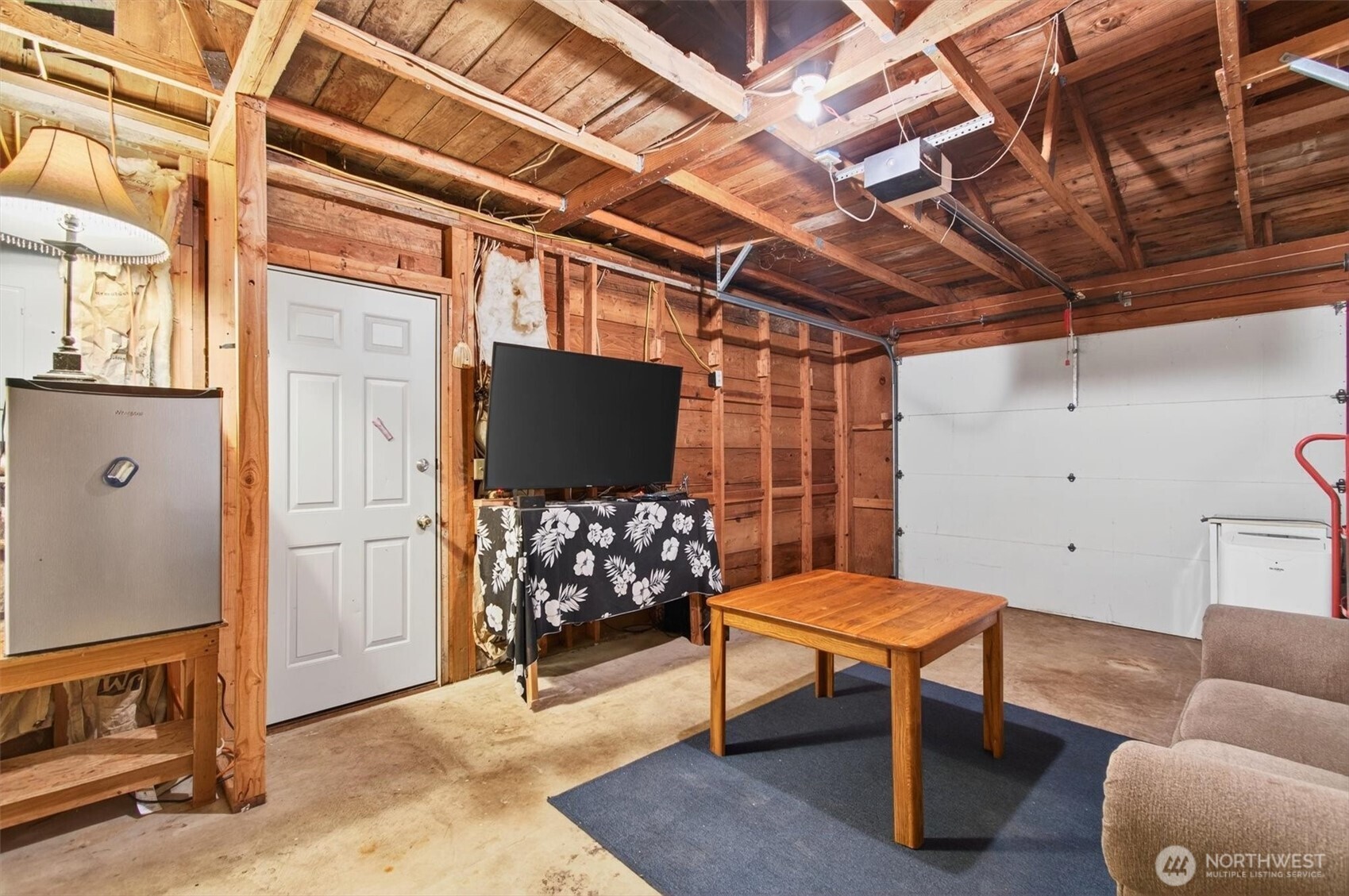 1015 Hazel Dell Road Castle Rock, WA 98611 - Photo 29 of 35 a living room with furniture a flat screen tv and a table