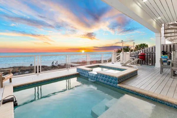 a view of swimming pool with outdoor seating