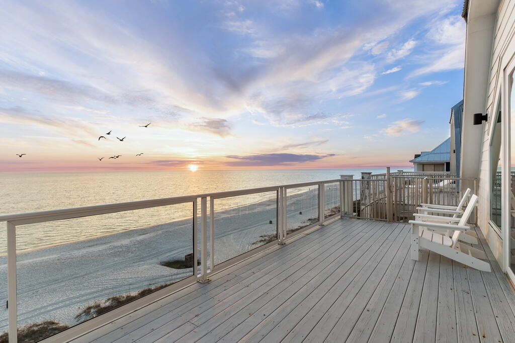 20405 Front Beach Road Panama City Beach, FL 32413 - Photo 102 of 130 a view of a terrace with wooden floor and city view