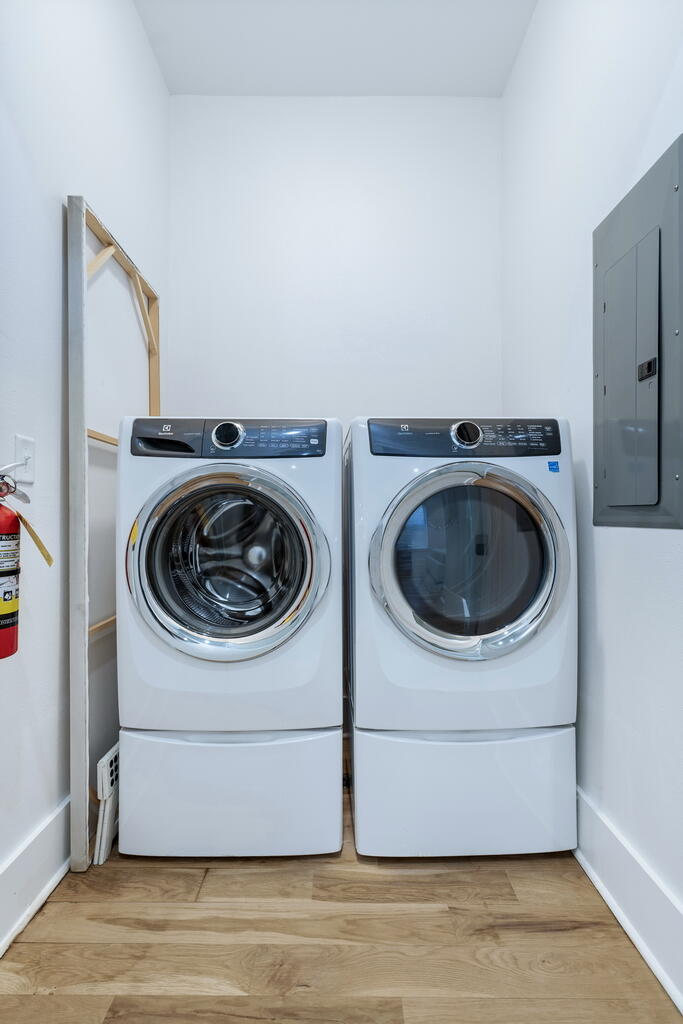 20405 Front Beach Road Panama City Beach, FL 32413 - Photo 79 of 130 a utility room with dryer and washer