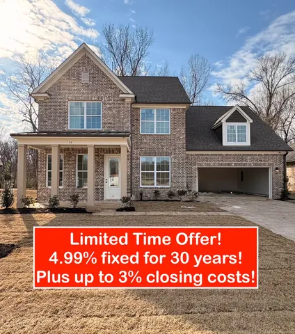 a sign that is sitting in front of a house