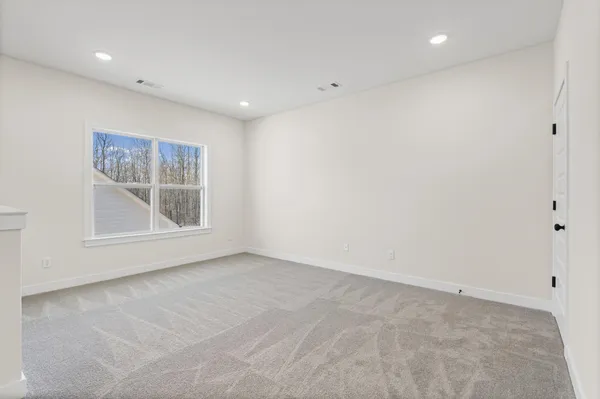 a bathroom with a tub a sink a mirror and a shower
