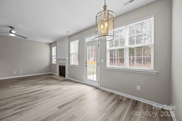 a view of kitchen with sink microwave and cabinets