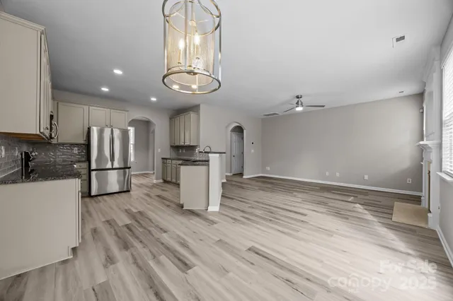 wooden floor in an empty room with a fireplace