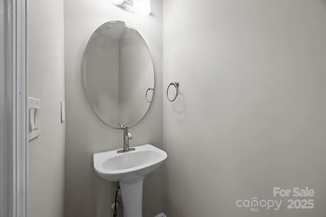 a view of a room with wooden floor and staircase