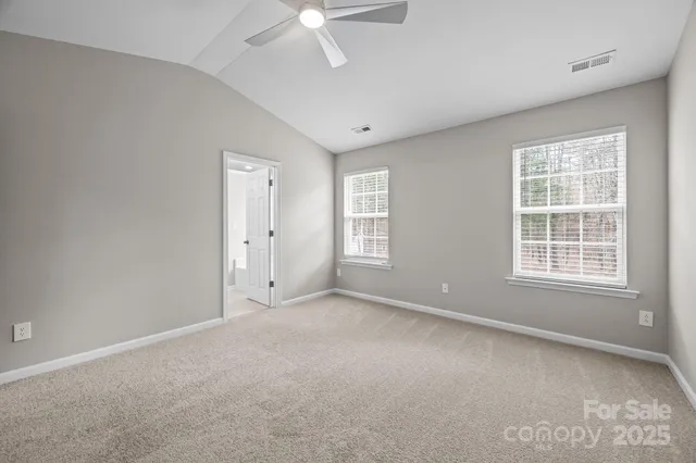 a bathroom with a granite countertop sink double and mirror