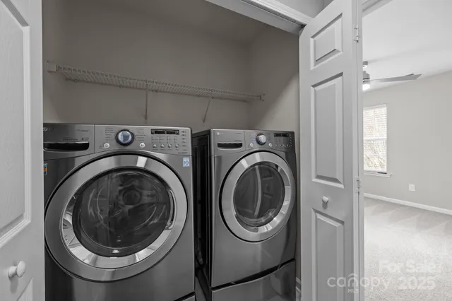 a backyard of a house with large trees and barbeque oven