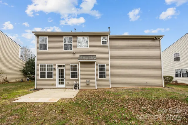 an aerial view of a house with a lake view