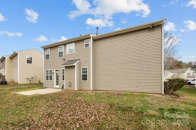 an aerial view of a residential houses with outdoor space