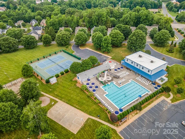 a view of a wrought iron fences in front of house