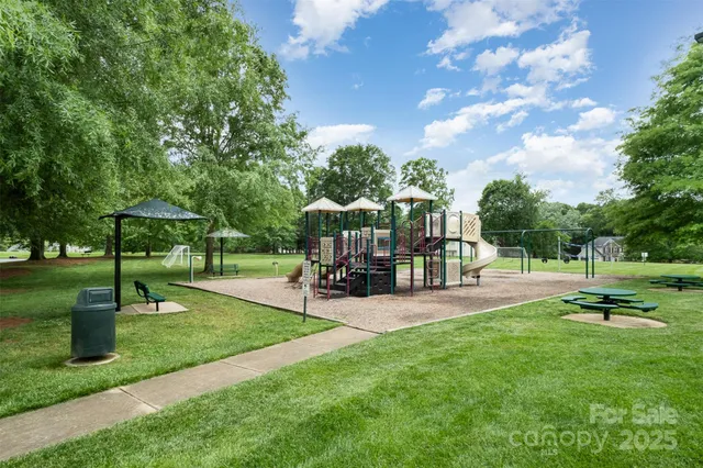 a view of outdoor space with garden and wooden fence