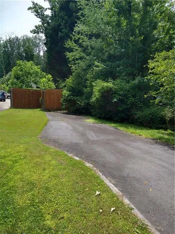 a backyard of a house with lots of green space