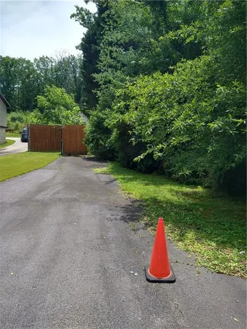 a backyard of a house with lots of green space