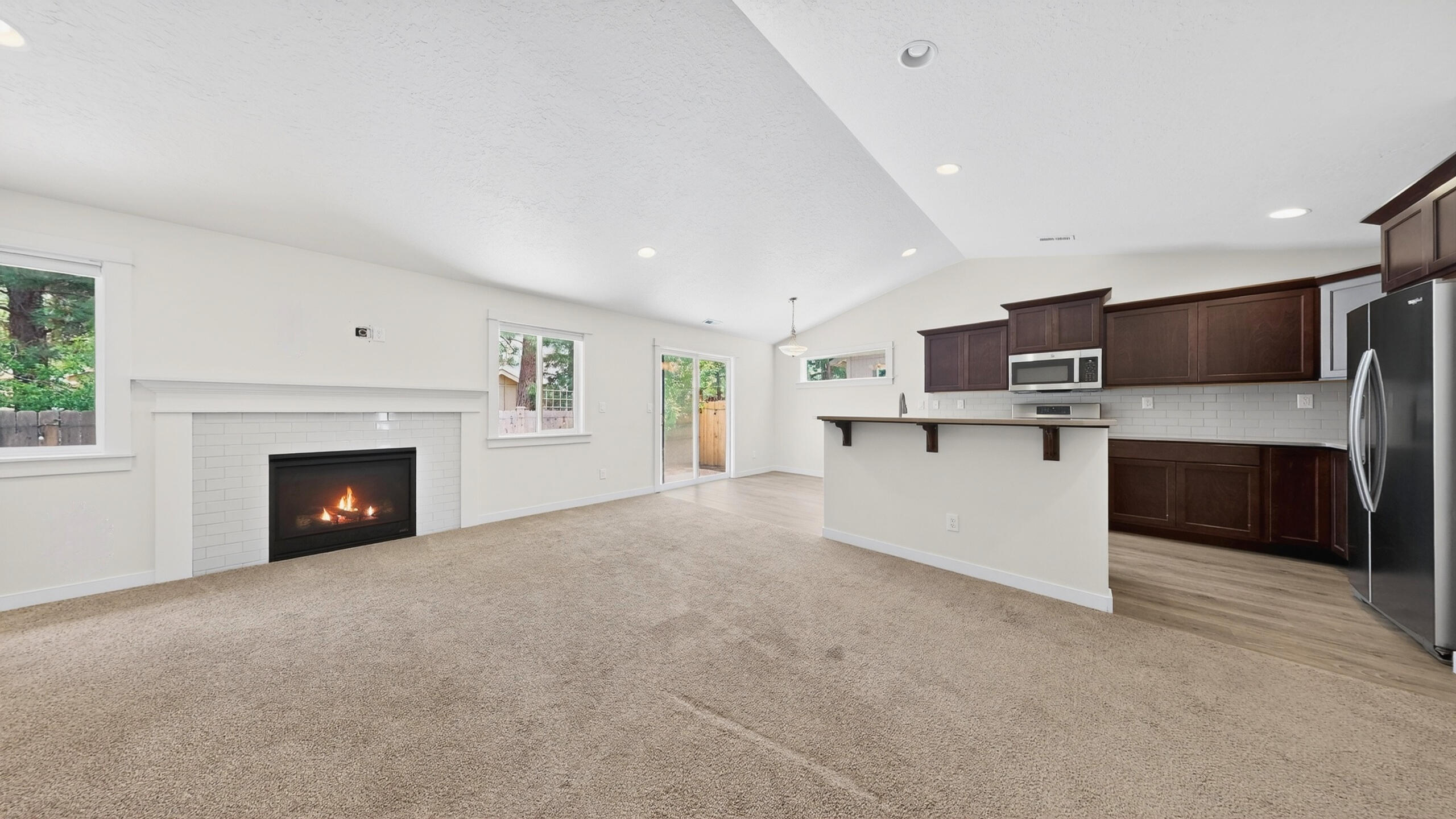 680 McKinney Ranch Road Sisters, OR 97759 - Photo 18 of 41 a view of kitchen with furniture and a fireplace