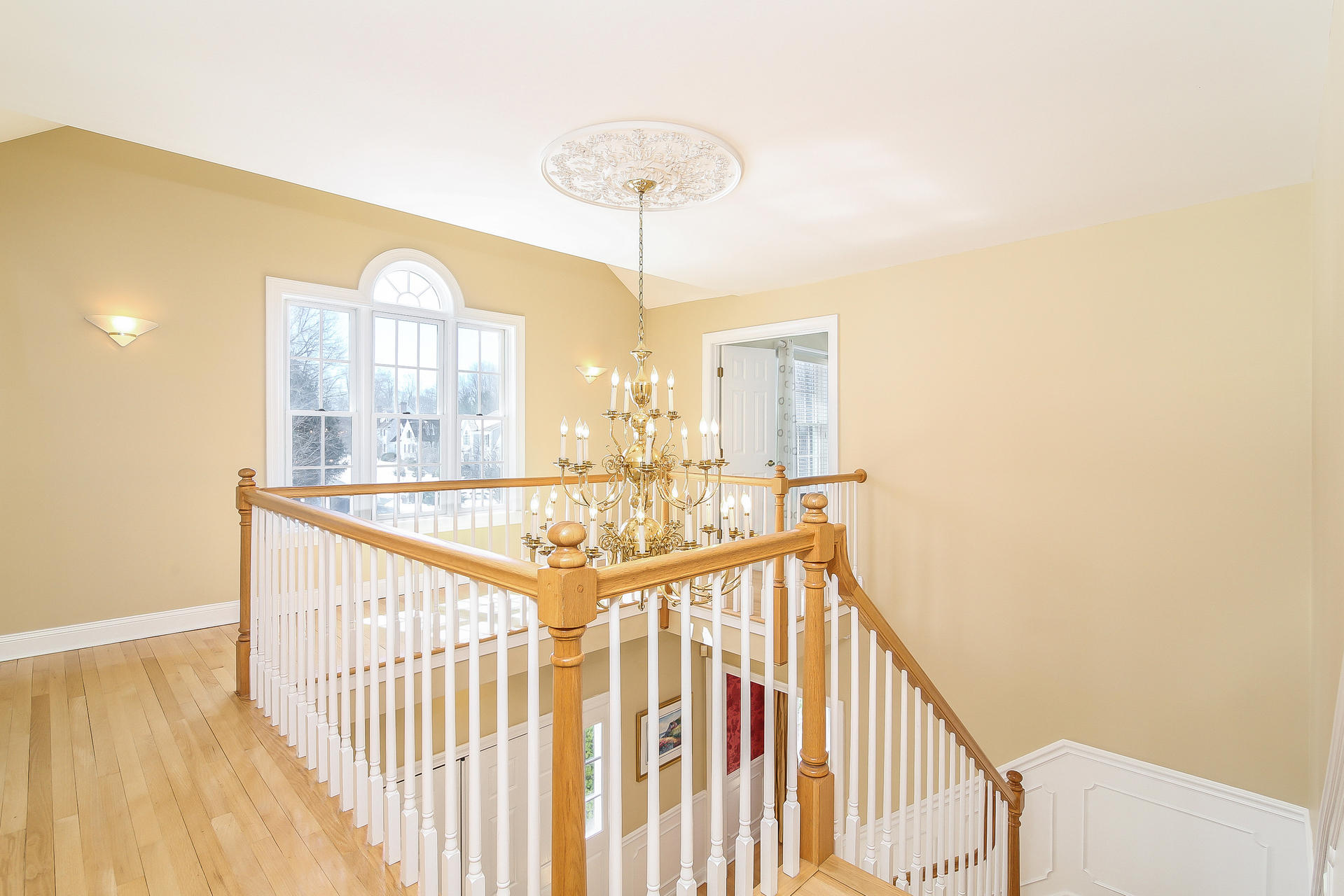 152 Old Studio Road New Canaan, CT 06840 - Photo 20 of 35 a view of a hallway with a chandelier