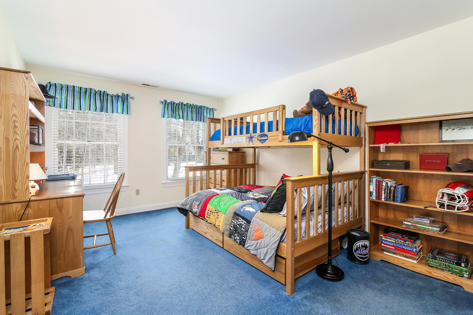 152 Old Studio Road New Canaan, CT 06840 - Photo 27 of 35 a bedroom with furniture a rug and a book shelf