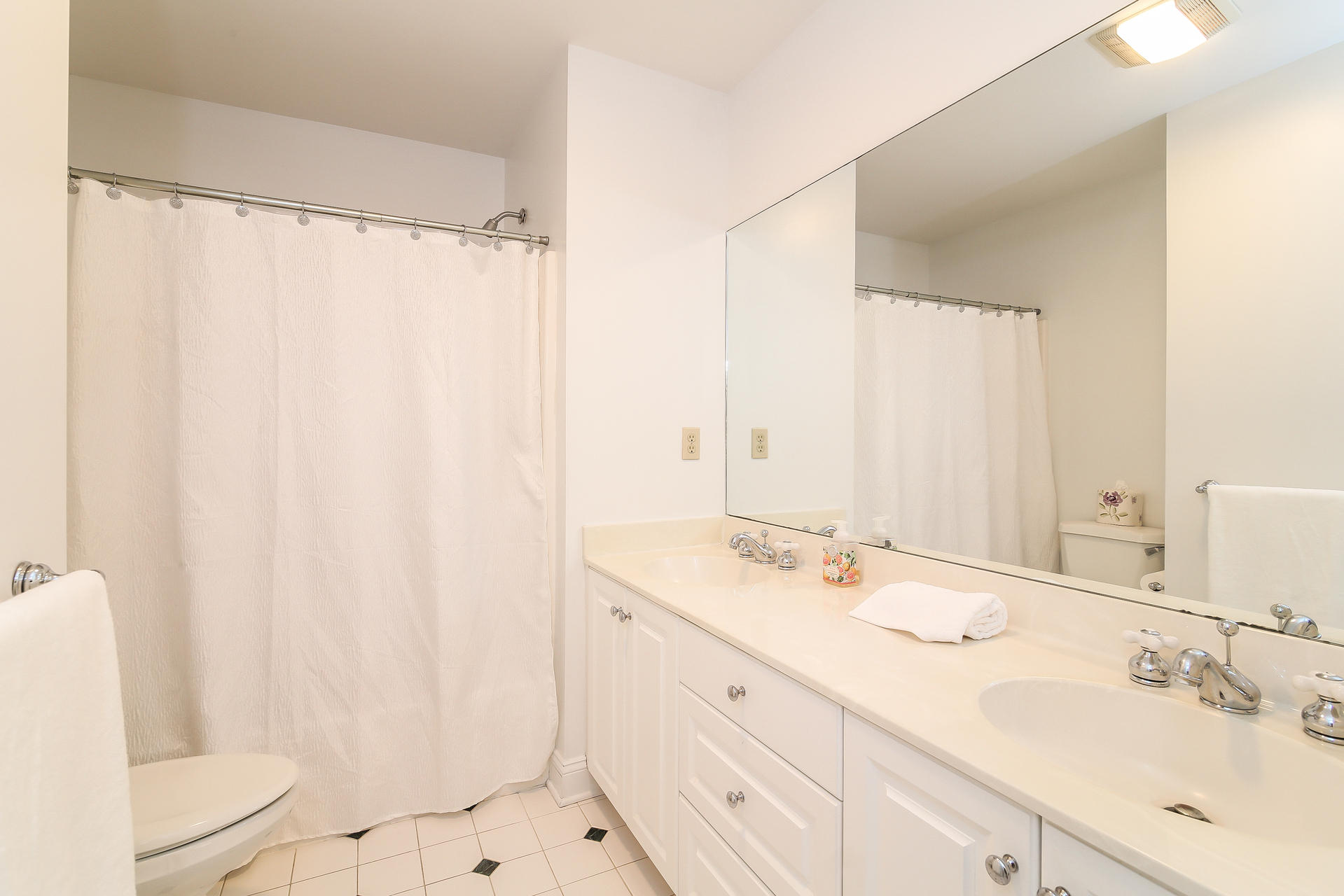 152 Old Studio Road New Canaan, CT 06840 - Photo 29 of 35 a bathroom with a sink and a mirror