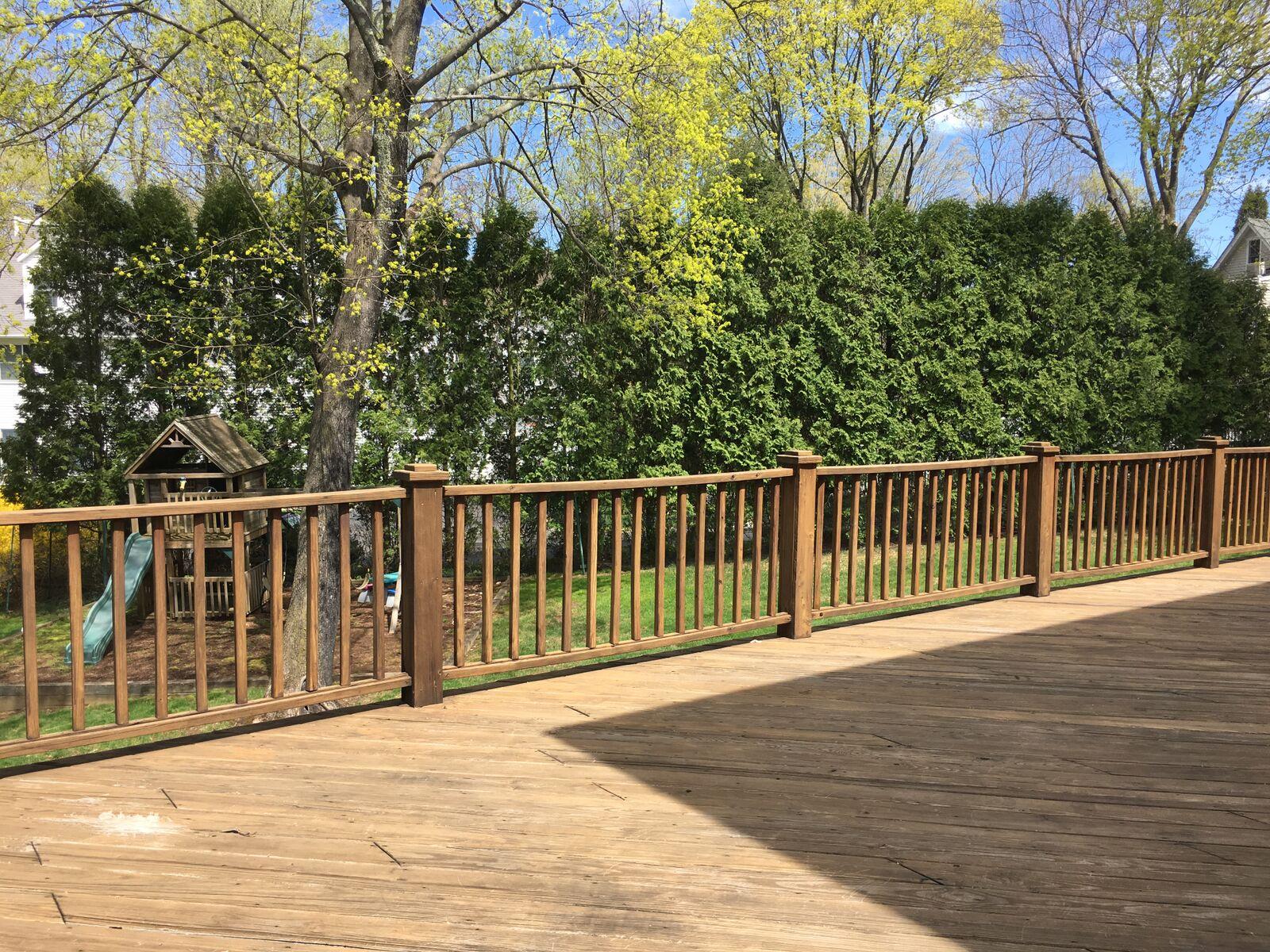 152 Old Studio Road New Canaan, CT 06840 - Photo 31 of 35 a view of a balcony with wooden floor and fence