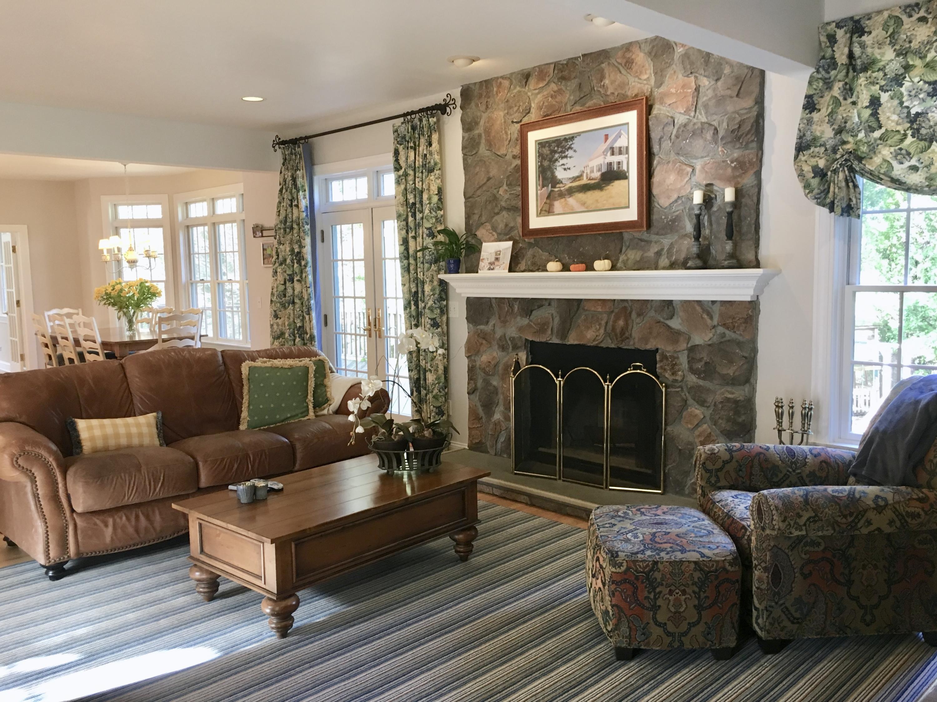 152 Old Studio Road New Canaan, CT 06840 - Photo 4 of 35 a living room with furniture and a fireplace