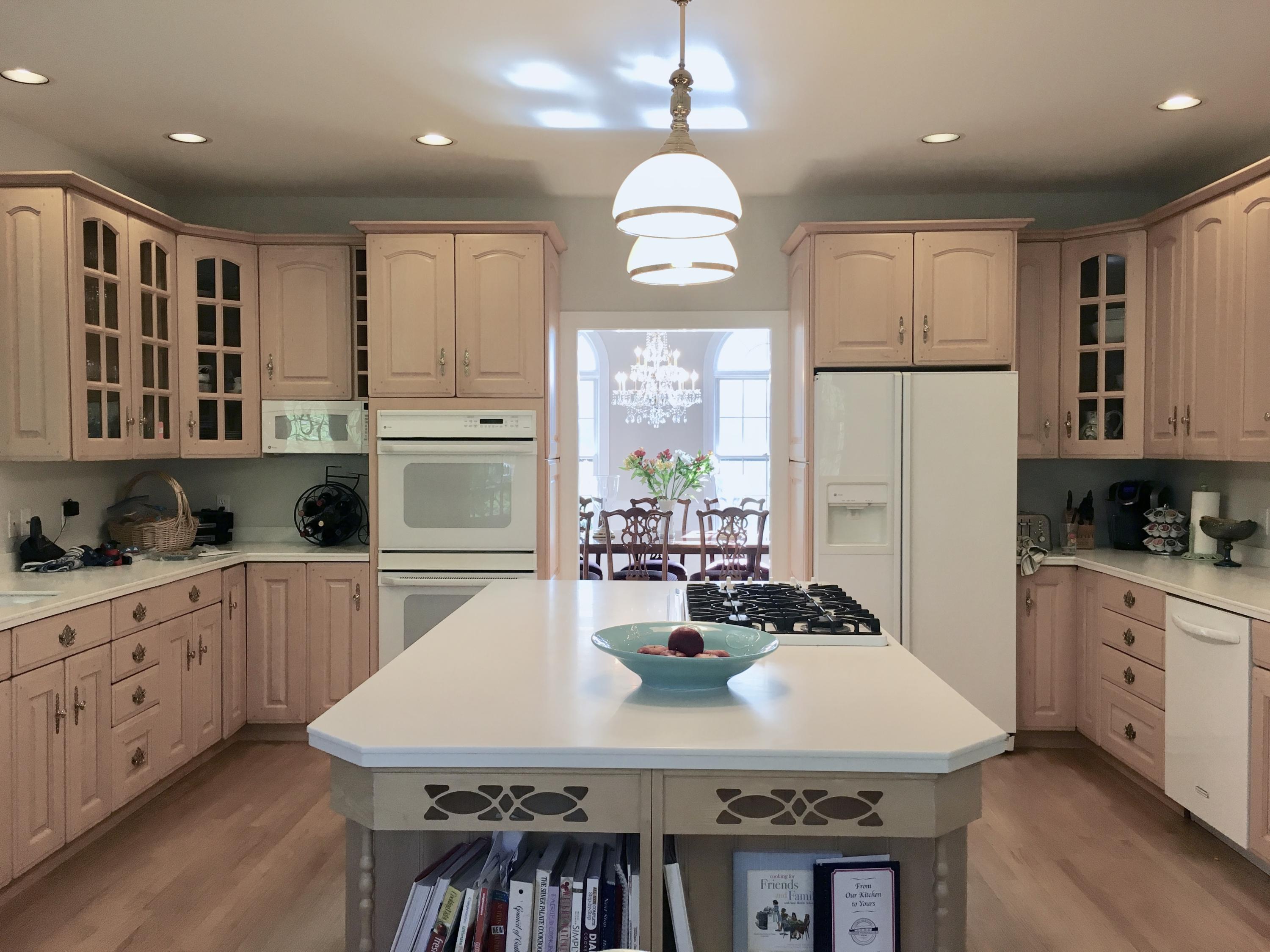 152 Old Studio Road New Canaan, CT 06840 - Photo 7 of 35 a kitchen with kitchen island granite countertop a sink a center island and cabinets