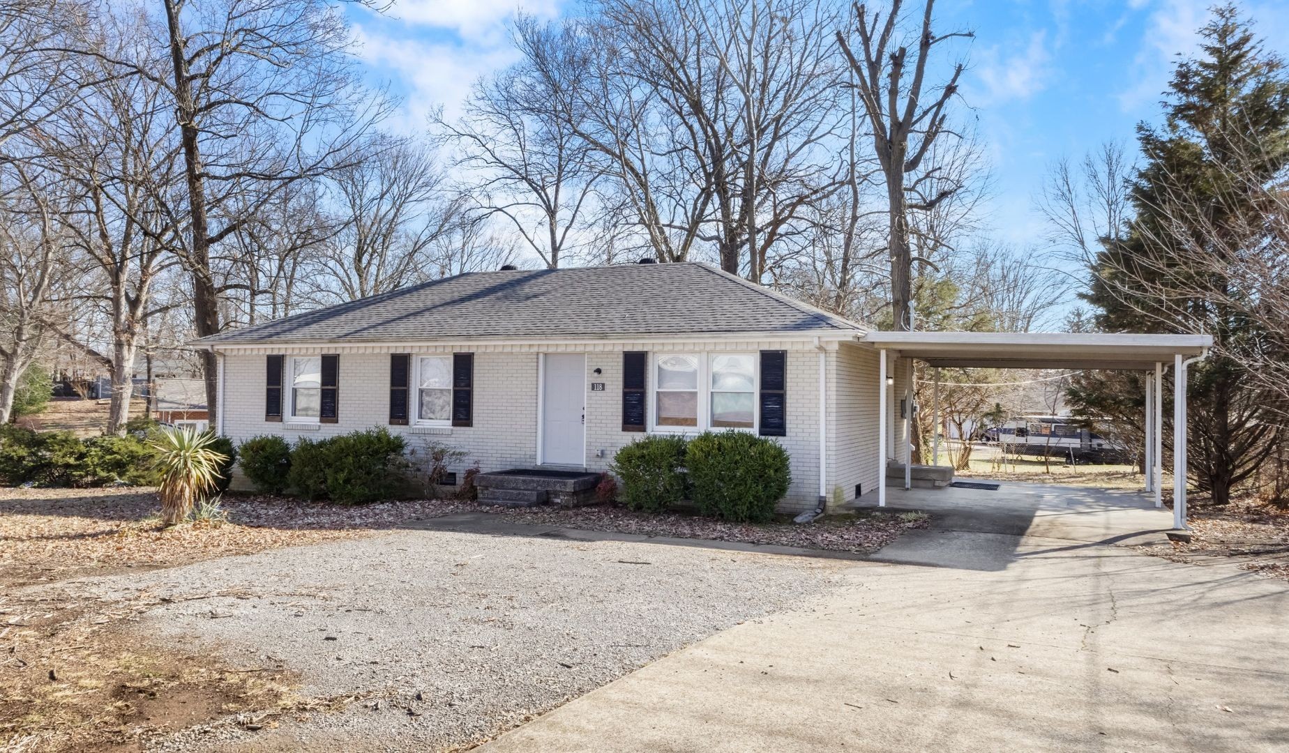 118 Union Hall Road Clarksville, TN 37040 - Photo 1 of 26 a front view of a house with a yard and potted plants