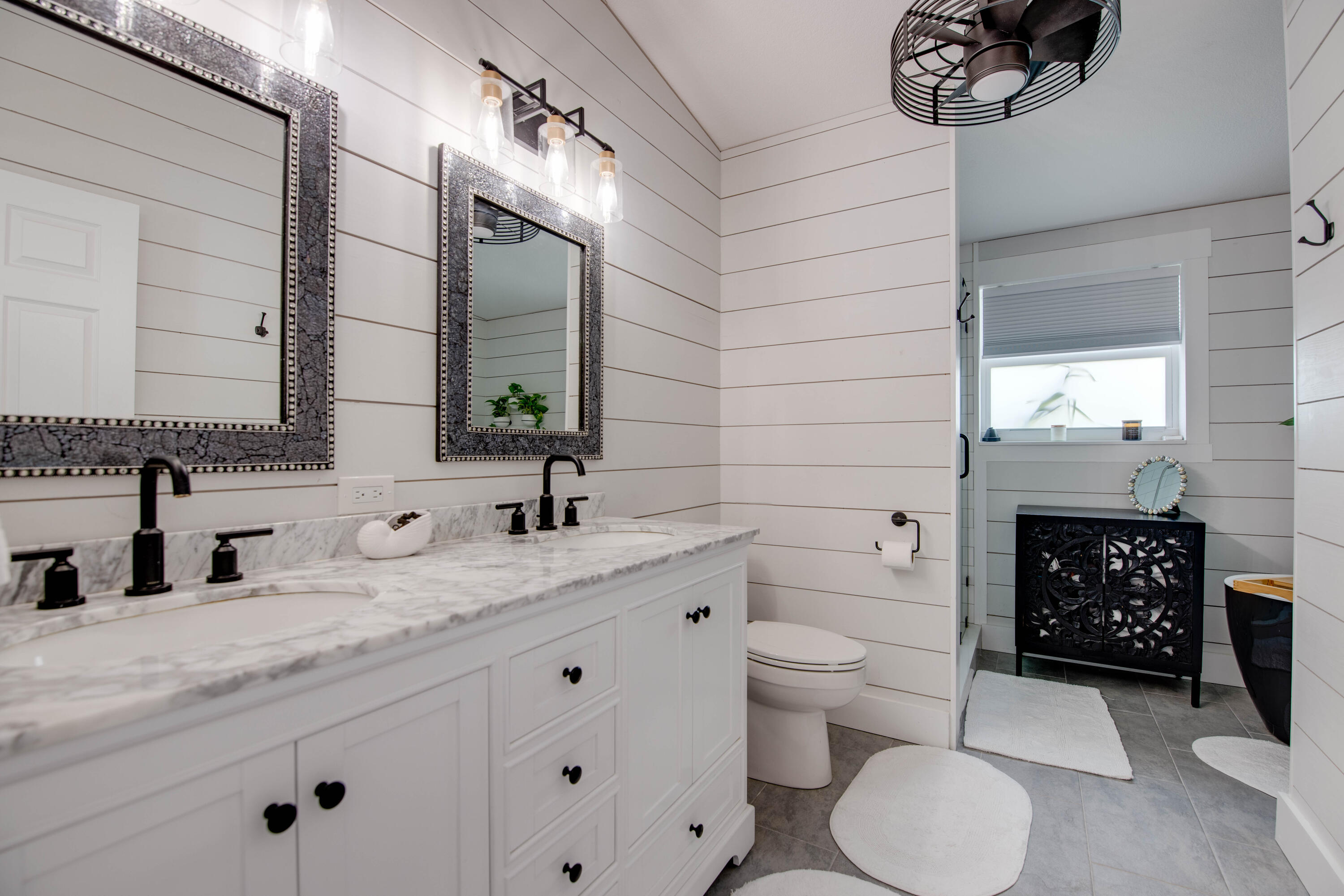 930 80th Street Marathon, FL 33050 - Photo 13 of 49 a bathroom with a granite countertop toilet sink and mirror